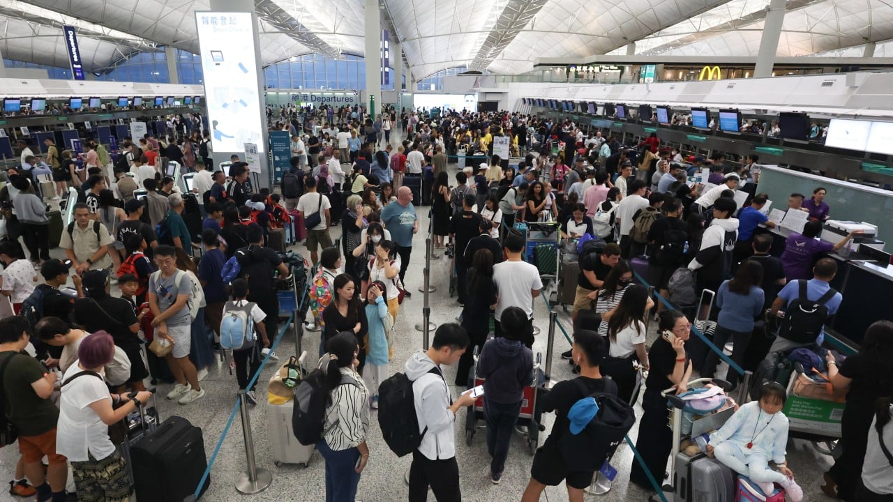 Hong Kong airport scrambles to deal with backlog of 500 flights as Wipha departs