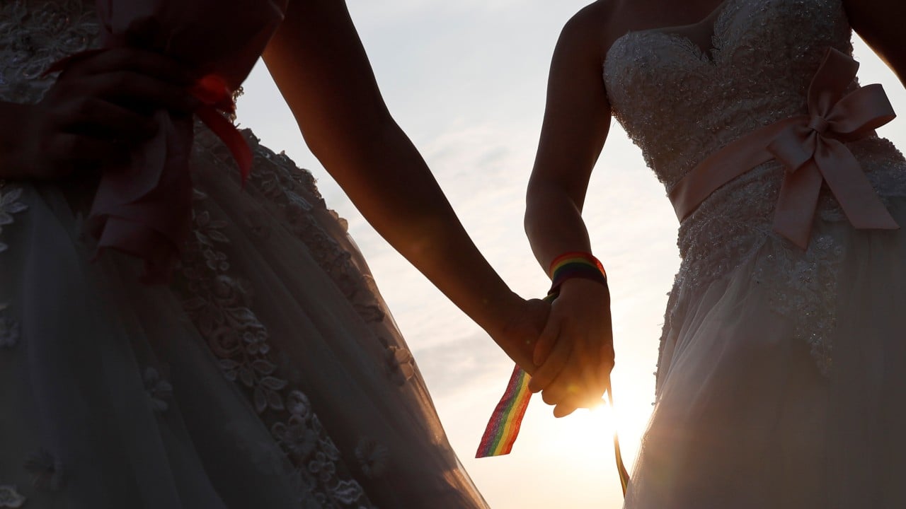 Hong Kong court backs lesbian couple on registering together as parents of son
