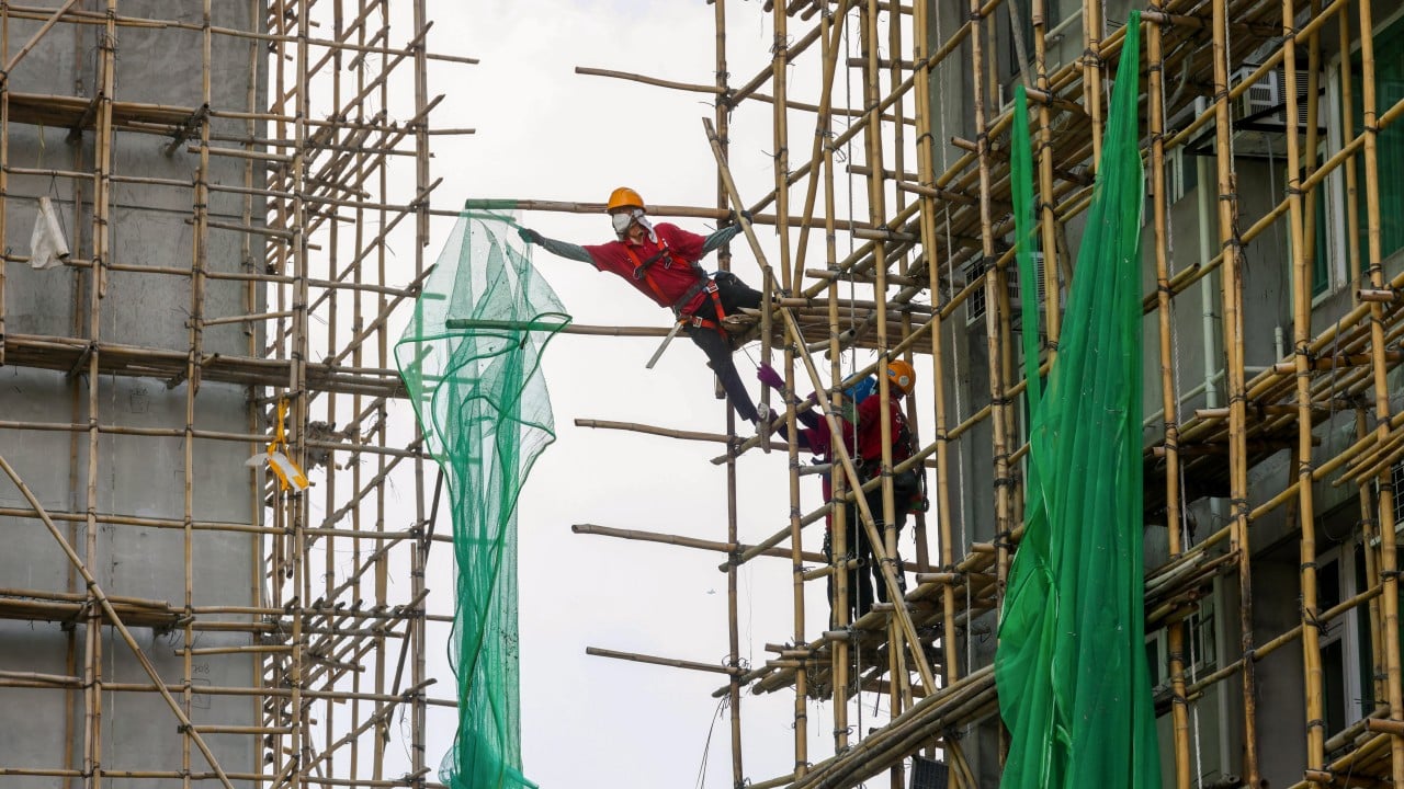 Hong Kong contractors race to remove scaffolding nets after Tai Po fire