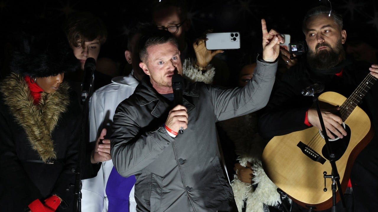 Hundreds join Tommy Robinson’s far-right rally in London: ‘Make Christmas Great Again’