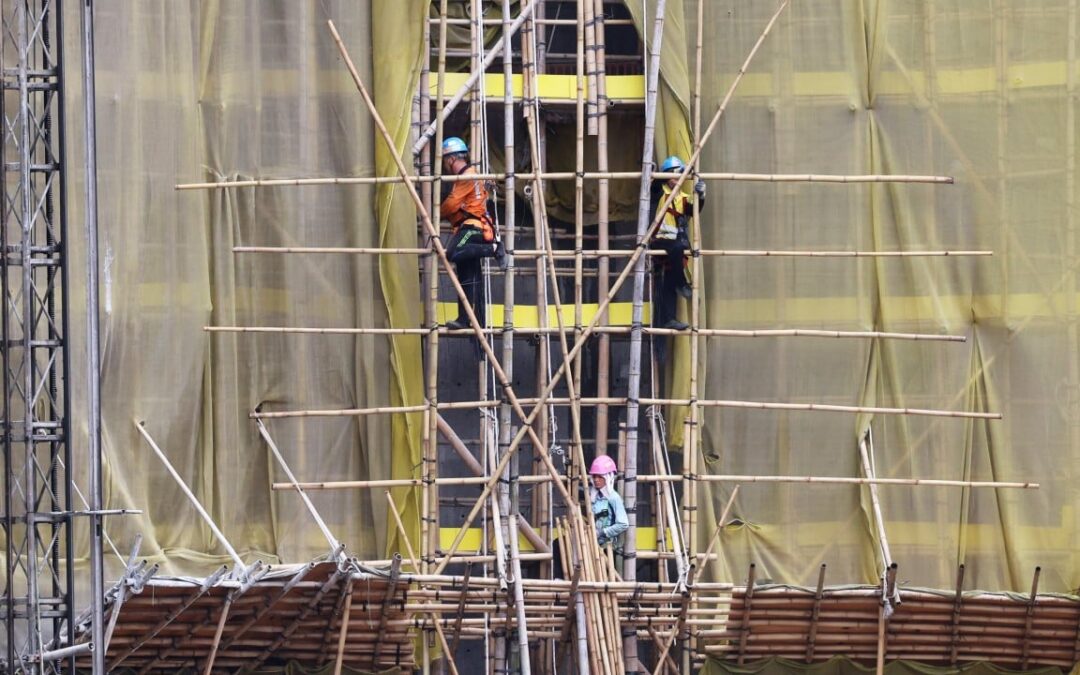 Hong Kong developers push for smoking ban at construction sites after deadly fire