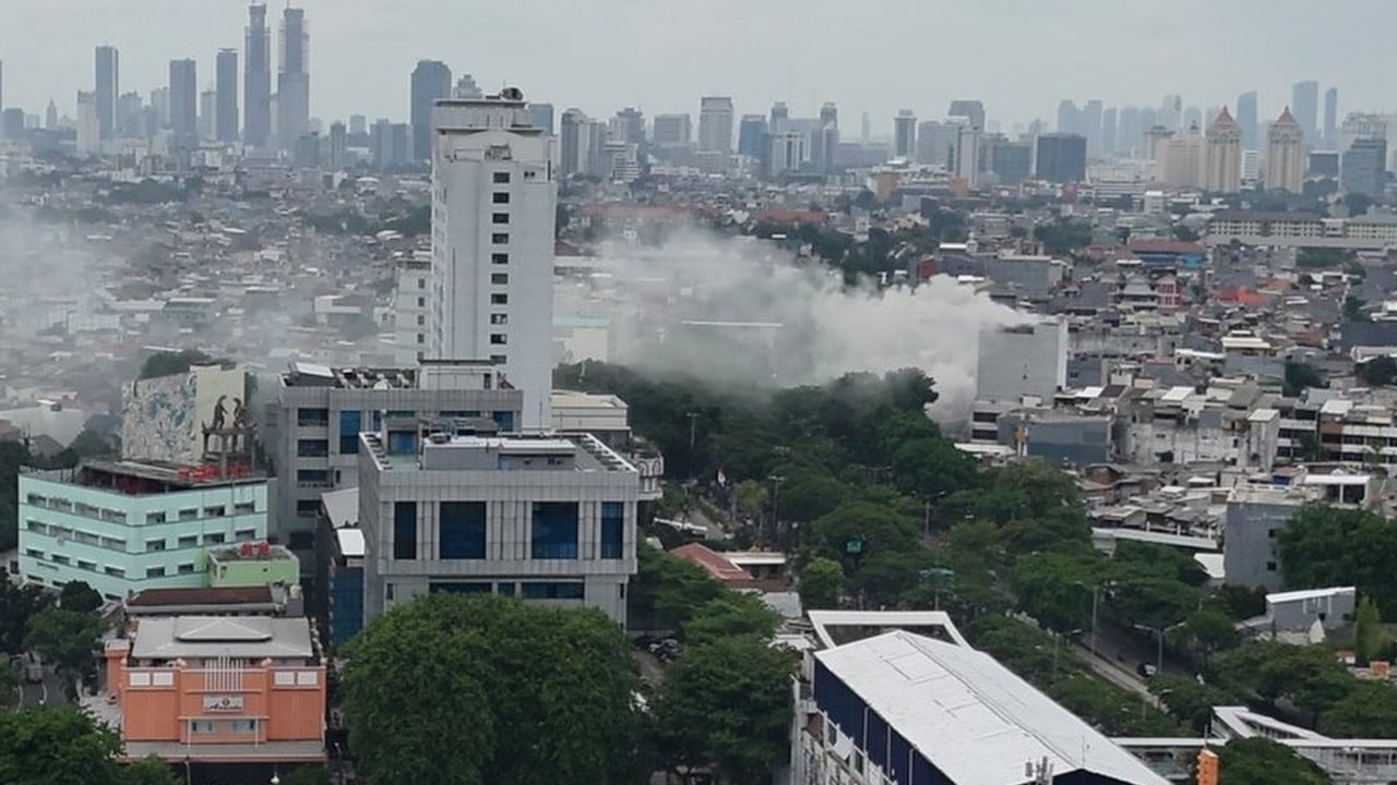 Office building fire in Indonesia’s Jakarta kills 13, people still trapped