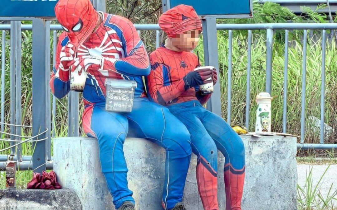 ‘Spider-Man’ beggar with girl sparks Malaysia child exploitation probe