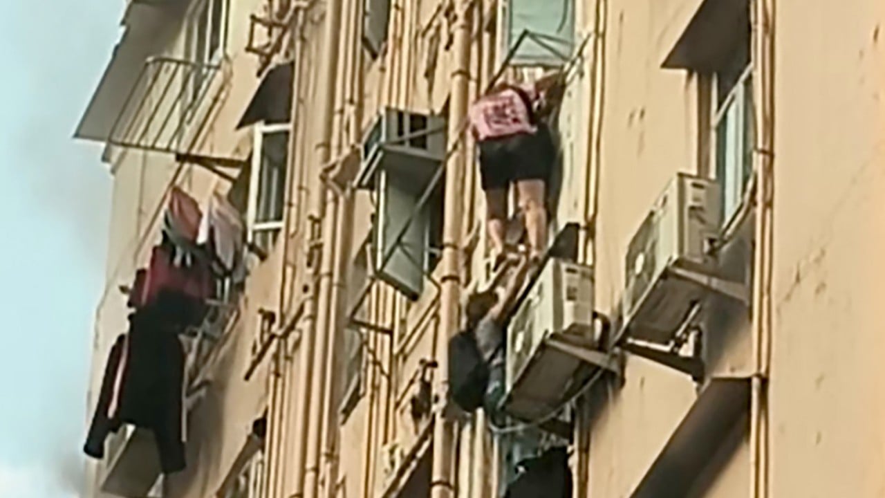 2 women climb out of window to flee Hong Kong building fire that injured 3 others