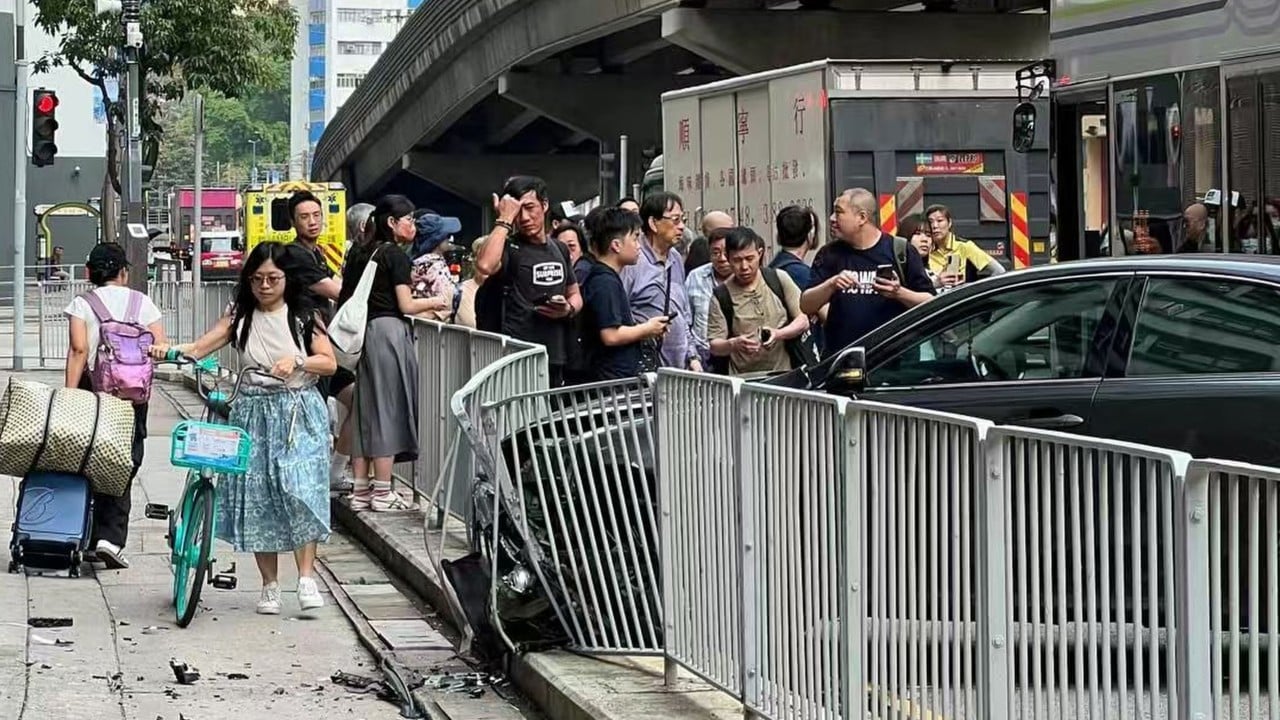 Hong Kong police searching for driver on the run after hitting railing and bus