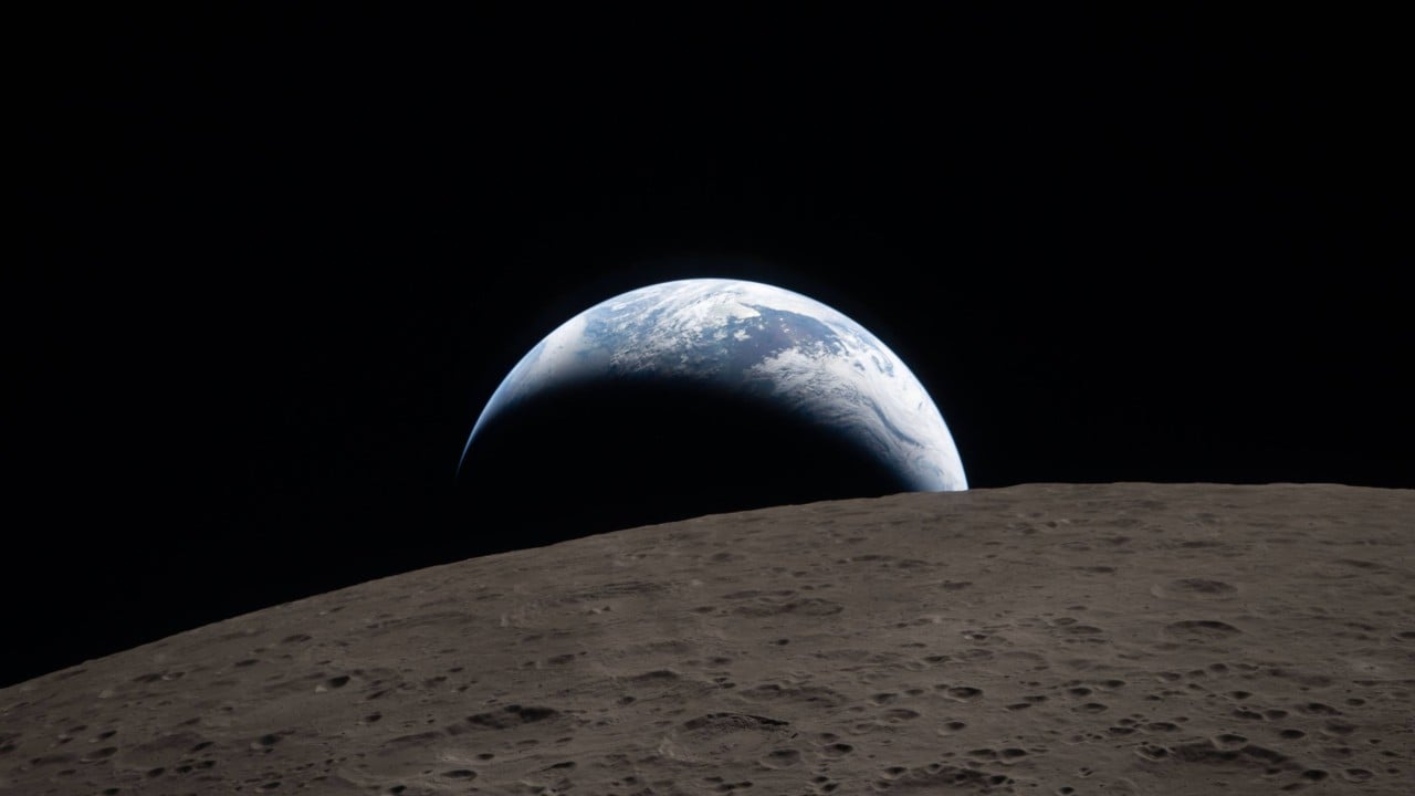 Nasa’s Artemis crew snaps historic Earthset photo on way home from moon
