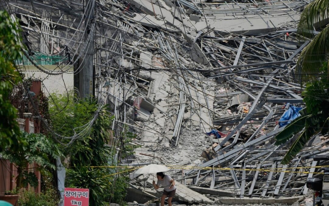 Philippine rescuers race to free workers trapped after hotel collapse