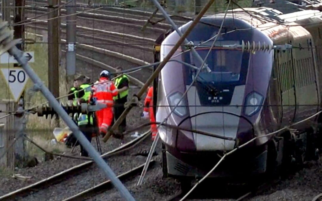 2 trains collide north of London, killing 1 and injuring dozens
