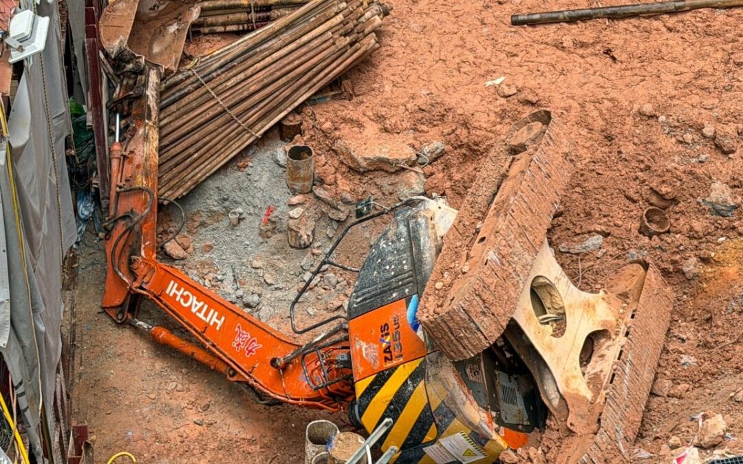 Worker killed, another unconscious after excavator tips over in Hong Kong