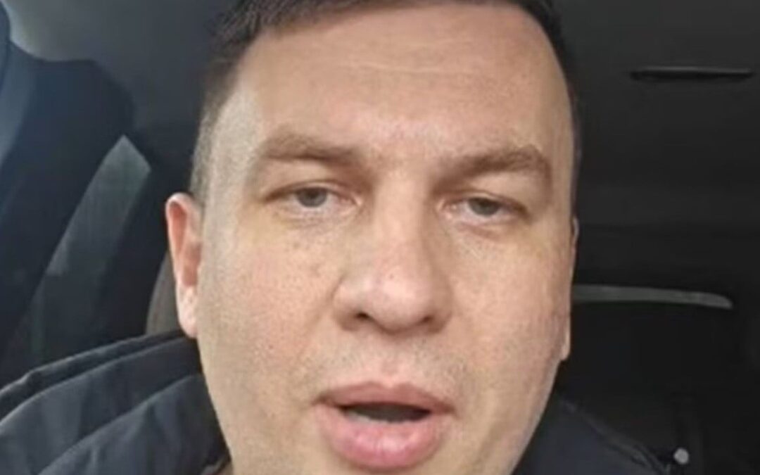 Russian activist arrested a day after predicting Putin will end up in handcuffs