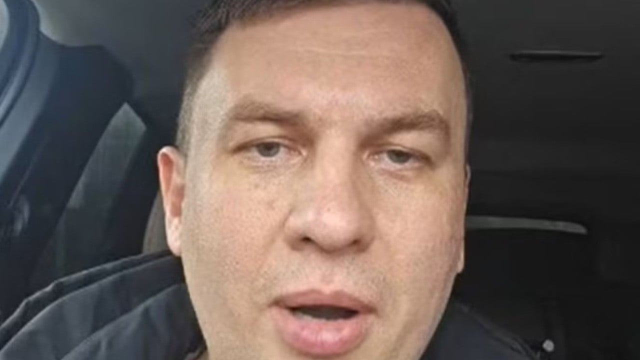 Russian activist arrested a day after predicting Putin will end up in handcuffs