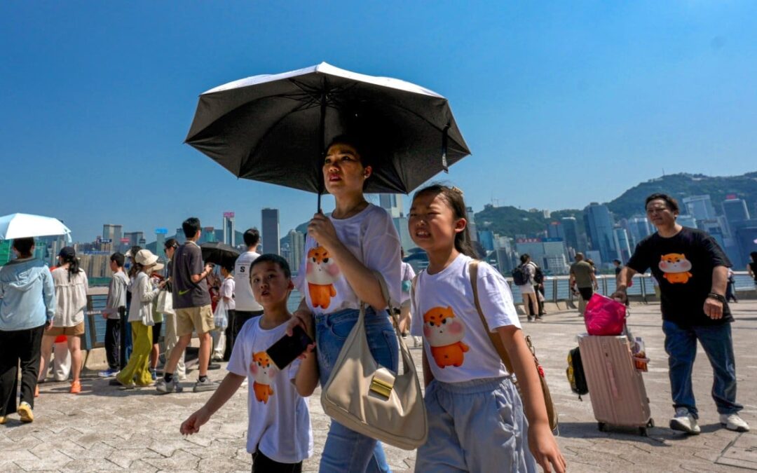 Hong Kong breaks record for hottest day as Typhoon Dolphin brings extreme heat