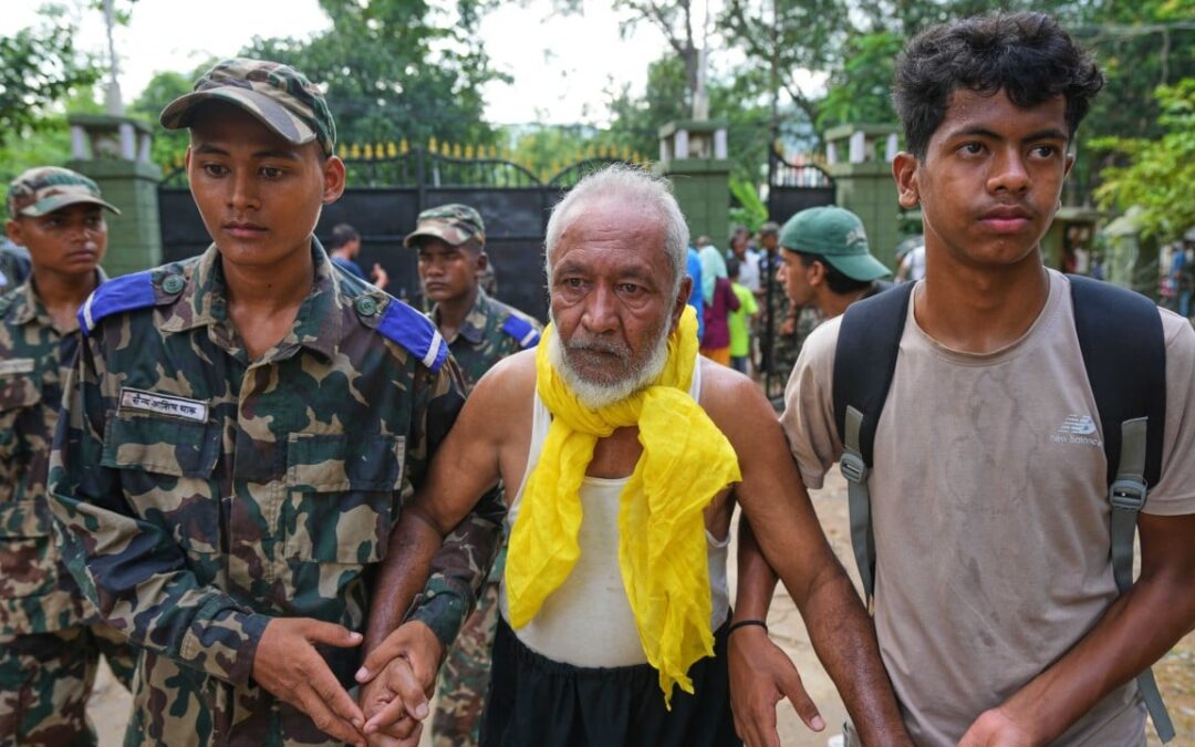 China-Nepal floods: rescuers pull out survivors caked in mud as toll climbs