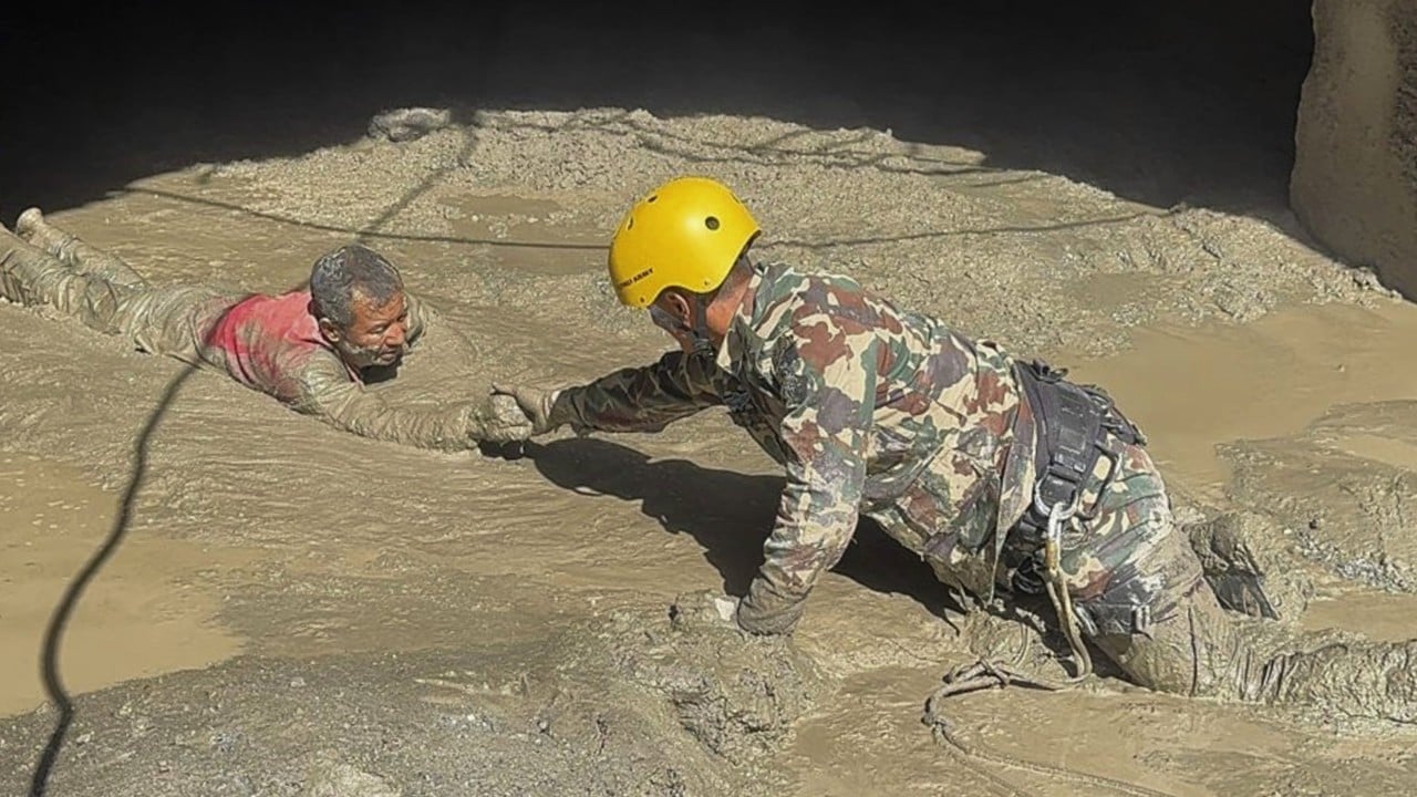 Nepal floods: rescuers send air pipe into tunnel with trapped workers