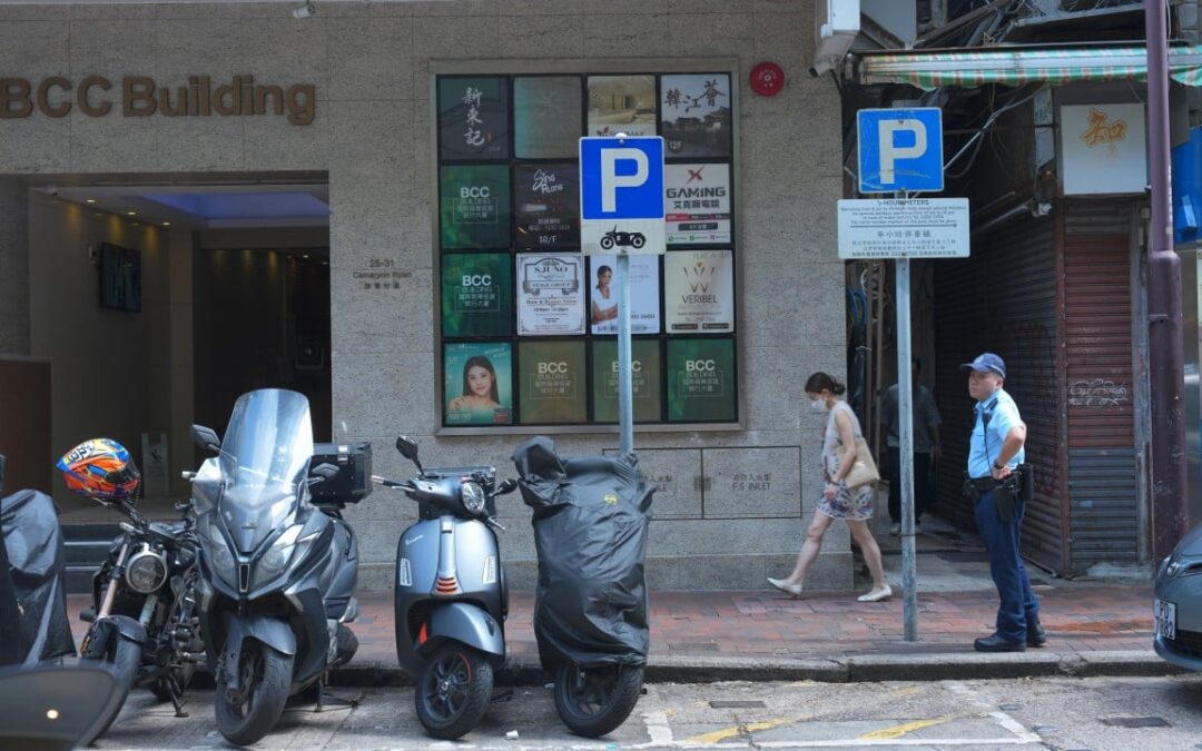 Hong Kong police search for woman after man found dead outside commercial building