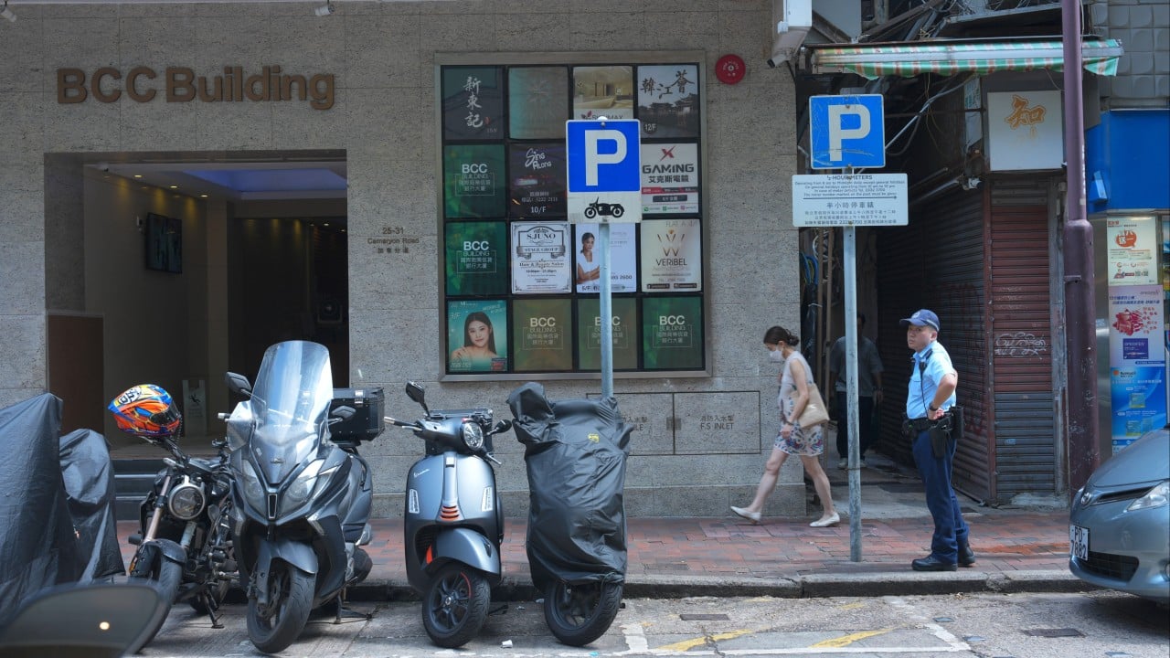 Hong Kong police search for woman after man found dead outside commercial building