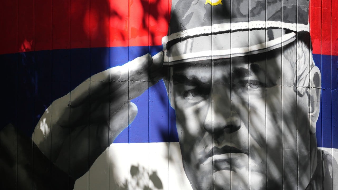 Body of war criminal Mladic returns to Serbia with military honours